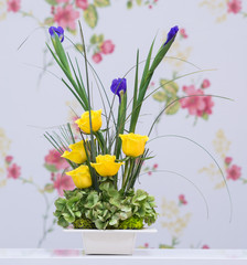 yellow roses and blue iris bouquet