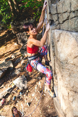 girl climber on a rock.