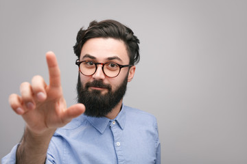 Handsome man touching air