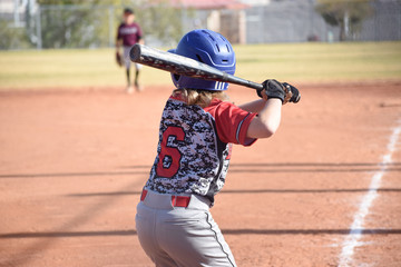youth baseball player at bat