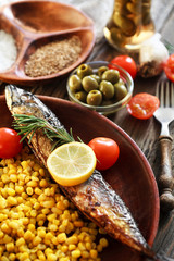 served fish with vegetables in a plate