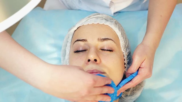 Skin Rejuvenation Treatment massage with facial cream, 4k footage.