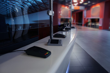 Cinema box office with terminals, closeup
