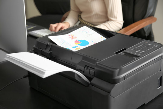 Printing document in office, closeup