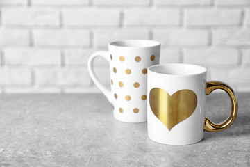 Two beautiful cups on table