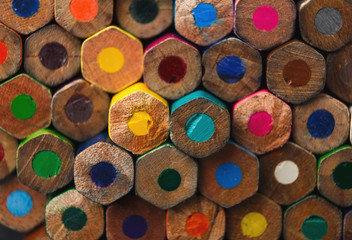 Stack of colorful pencils tips, art background