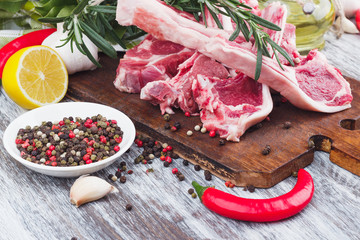Raw lamb chop on the wooden board