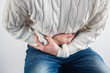 Male stomachache on a white background