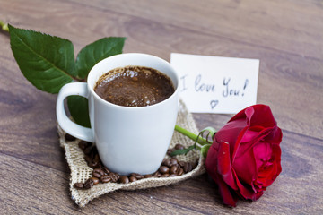 coffee cup with red rose and i love you message card 