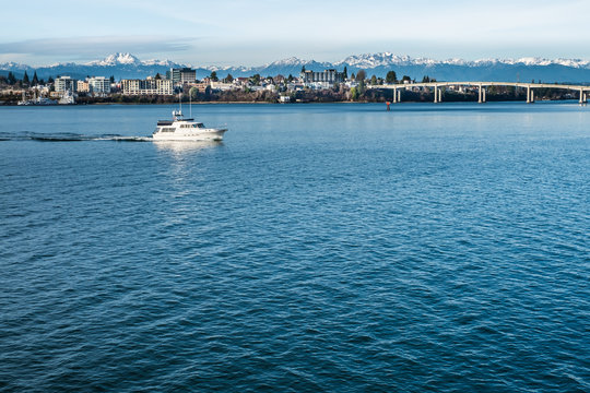 The Olympic Mountains provide a backdrop to the Bremerton skyline as seen from Puget Sound 