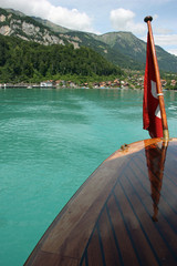 Swiss flag at luxury wooden boat