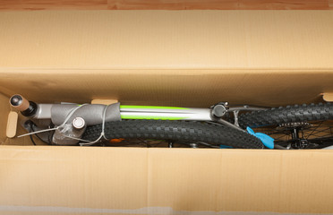 Bike in paper box, photo from unboxing bike. Saddle, front wheel  and handlebars are removable.