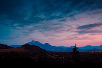 Scenic blue and pink sunset in mountains