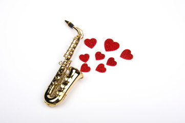 Saxophone with hearts. Flat lay, top view