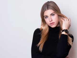 beautiful young woman with long hair wearing wrist watch