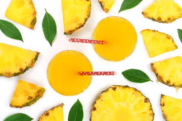 pineapple juice in a glass with pineapple slices isolated on white background. Top view. Flat lay pattern