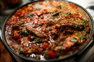 Chakhokhbili. Chicken with herbs and tomato.