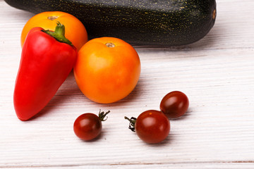 fresh farmyard vegetables on the rustic background
