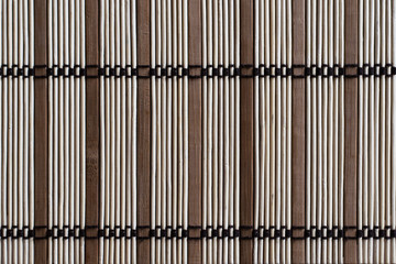 sushi mat, made from bamboo sticks of different sizes