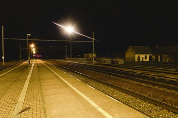 Fototapeta na wymiar Railway station at the night. European railway station.