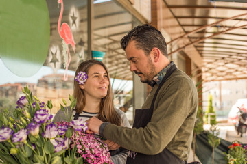 Florist couple working in a flower shop