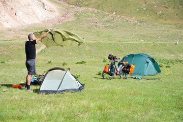 Long distance cycling on the M41 Pamir Highway, Camping at the Kyrgyz / Tajik border, Pamir Mountain Range © Travel Nerd