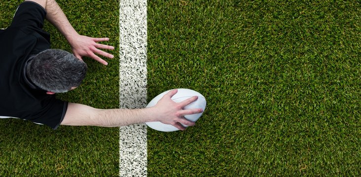 Composite image of a rugby player scoring a try