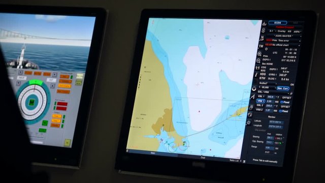 Student in Naval School using touch screen on simulation program to practice navigation