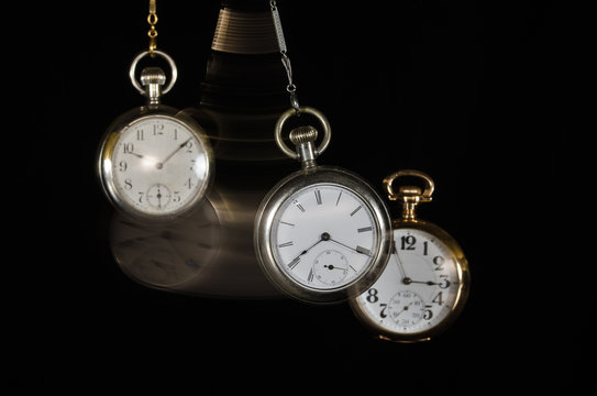 Swinging Pocket Watches Beckoning You to Look More Closely