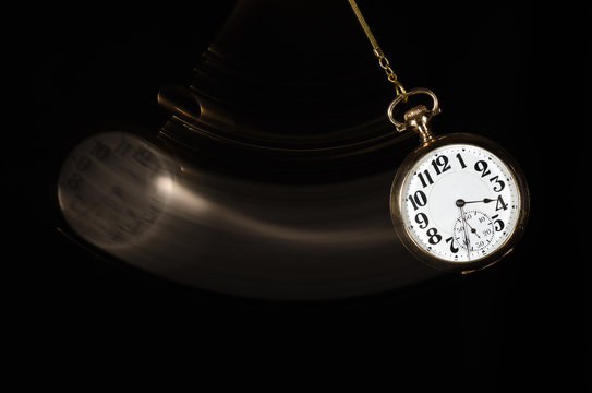 Swinging Pocket Watch Beckoning You to Look More Closely