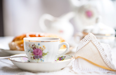 Luxury porcelain tea set with a cup, teapot, sugar bowl