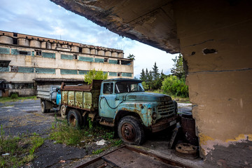 Old rusty truck at abandoned industrial area