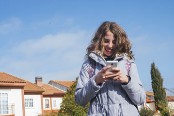 teenage girl student with smartphone