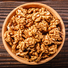 Walnut on a dark rustic wooden background