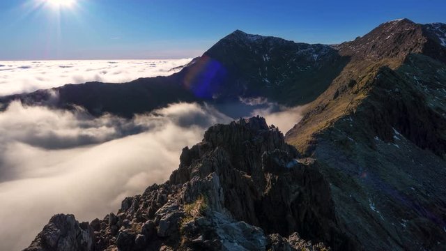 Crib Goch timelapse in Snowdonia with moving clouds in the valleys.