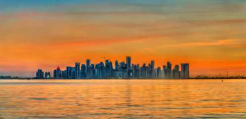 Fototapeta na wymiar Skyline of Doha at sunset. The capital of Qatar