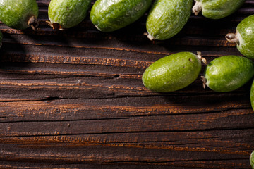 fresh fruits of the feijoa on the rustic background