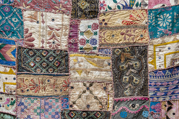 Detail of a old patchwork carpet
