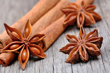 Star anise with cinnamon on wooden table