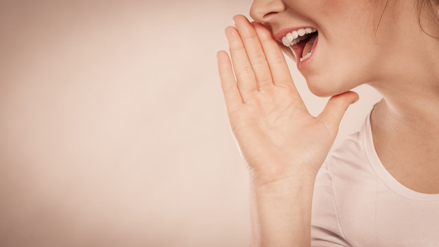 Woman Talking Gossip With Hand Close To Lips