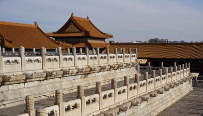 White fences and yellow roof tops in forbidden city in Beijing China