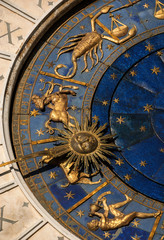 Ancient time Horoscope and Astrology. Detail of Saint Mark Square renaissance Clock Tower in Venice with zodiac signs, planet and stars (15th century)