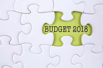Fototapeta premium Business concept: Missing jigsaw puzzle with word BUDGET 2018.