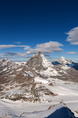 Winter panorama of mount Matterhorn covered with clouds, Canton of Valais, Alps, Switzerland 