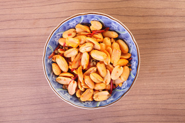 Spicy coated peanuts in the bowl   