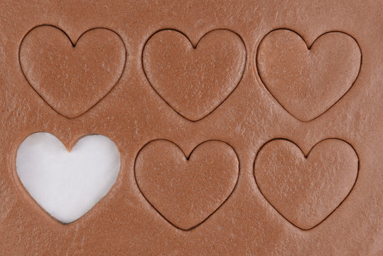 Six heart shapes in chocolate cookie dough