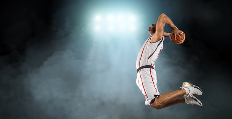 Caucassian Basketball Player in dynamic action with ball in a pr