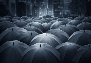 Many of black umbrella in the city. insurance policy Life health protection concept. - obrazy, fototapety, plakaty