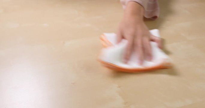 Cleaning with rag on table