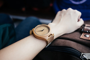 classic accessory background hand of business women wearing wooden watch with copy space. image for body, retro, outdoor, vintage, luxury, equipment concept - Powered by Adobe